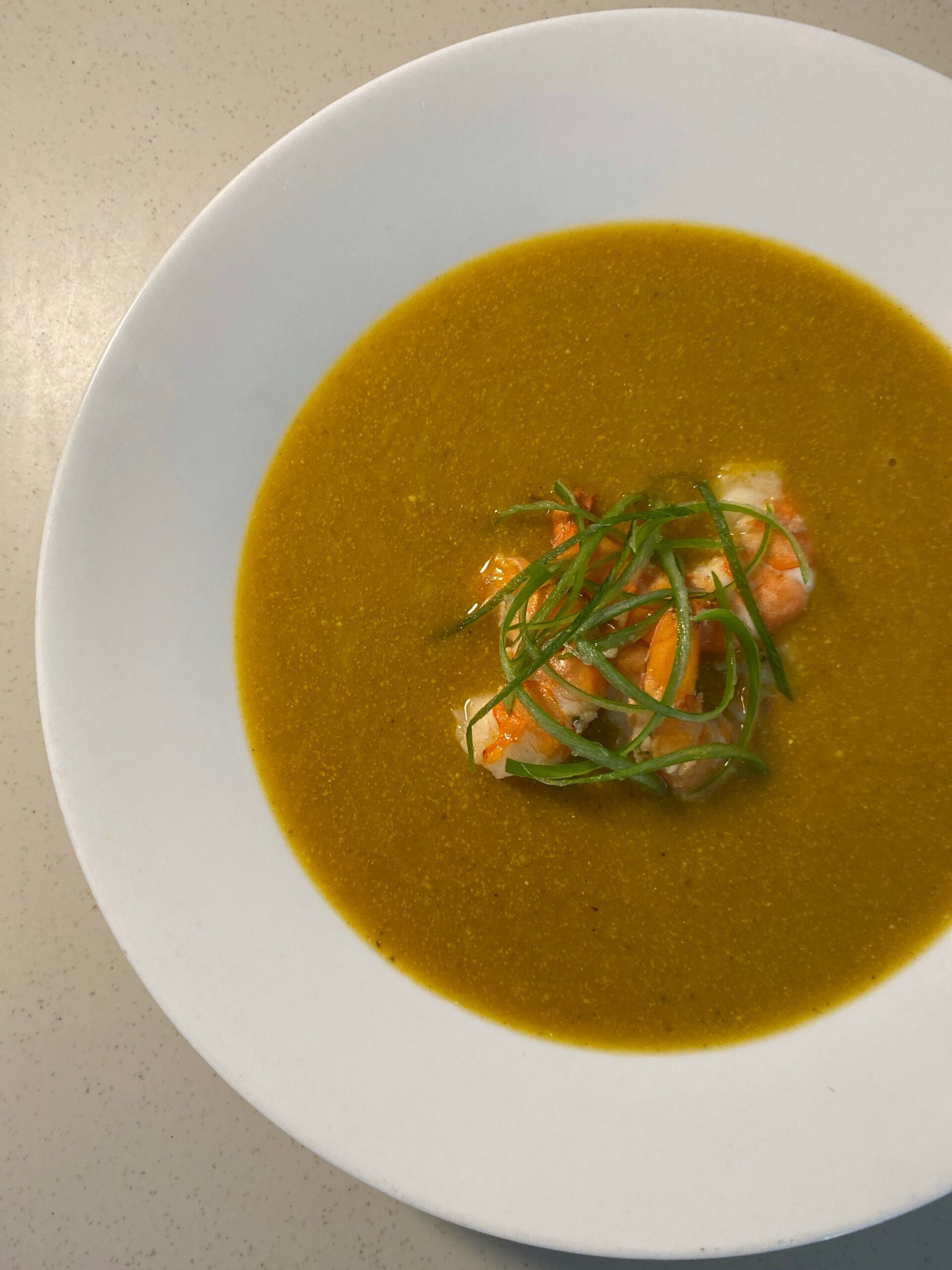 Golden Shrimp and Squash Bisque with tender shrimp pieces and fresh green onions