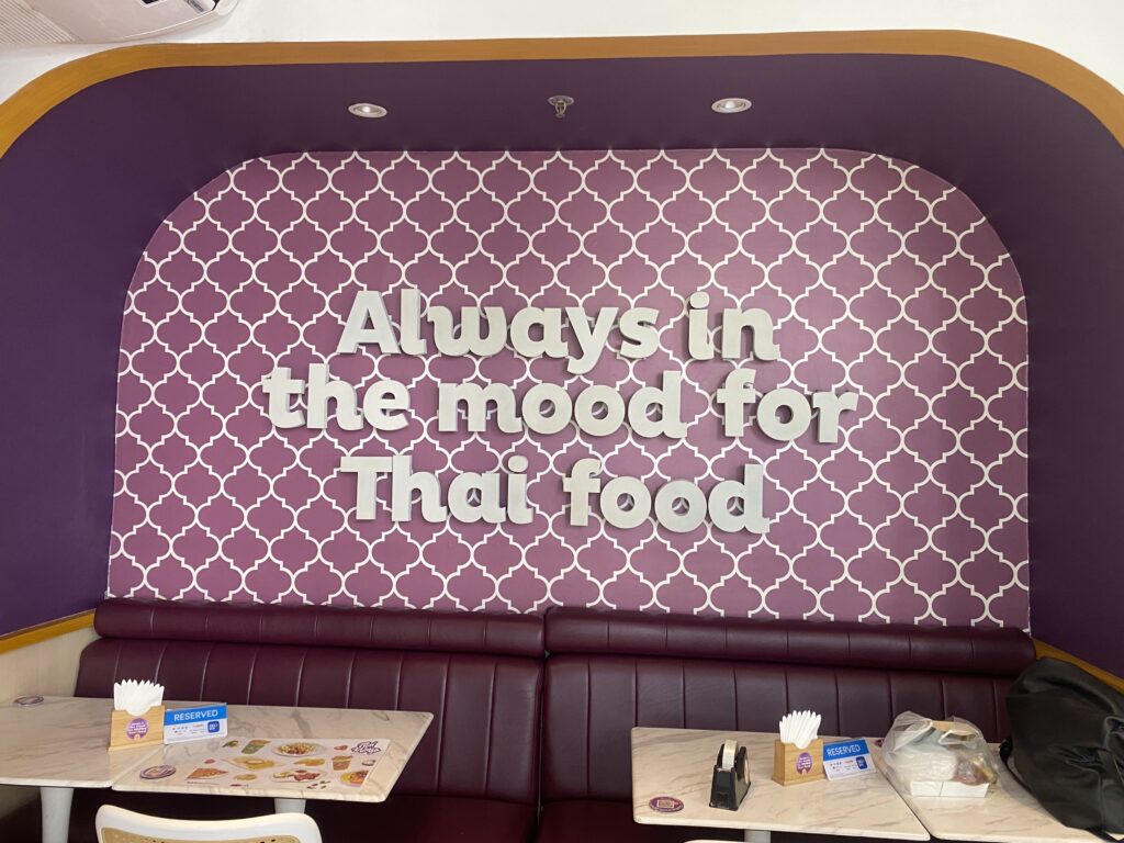 Wall decor saying ‘Always in the Mood for Thai Food