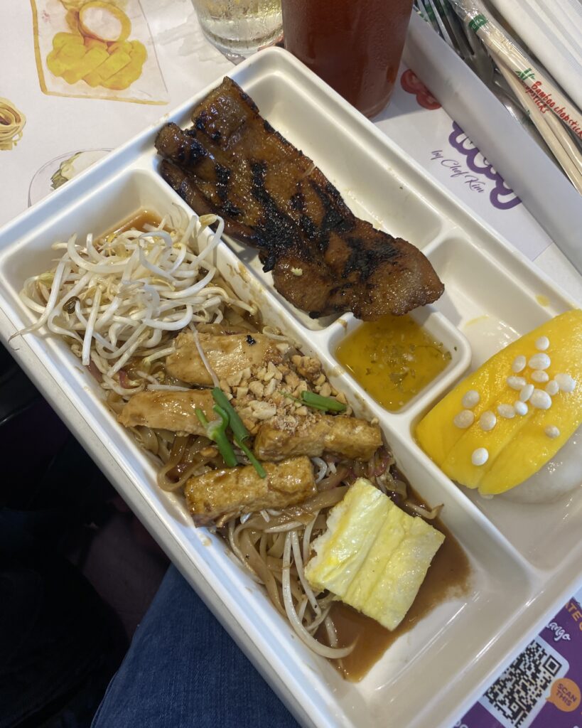 Set meal featuring Pad Thai, Thai Pork Belly, Mango Sticky Rice, and Iced Tea